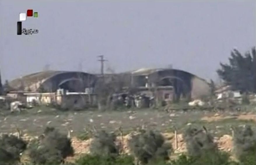 This frame grab from video provided by the Syrian official TV, a Syrian government channel that is consistent with independent AP reporting, shows the burned and damaged hangar warplanes which attacked by U.S. Tomahawk missiles, at the Shayrat Syrian government forces airbase, southeast of Homs, Syria, Friday April, 7, 2017. (Syrian government TV, via AP)
