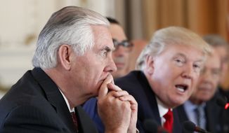 Secretary of State Rex Tillerson, left, listens as President Donald Trump speaks during a bilateral meeting with Chinese President Xi Jinping at Mar-a-Lago, Friday, April 7, 2017, in Palm Beach, Fla.  (AP Photo/Alex Brandon) **FILE**