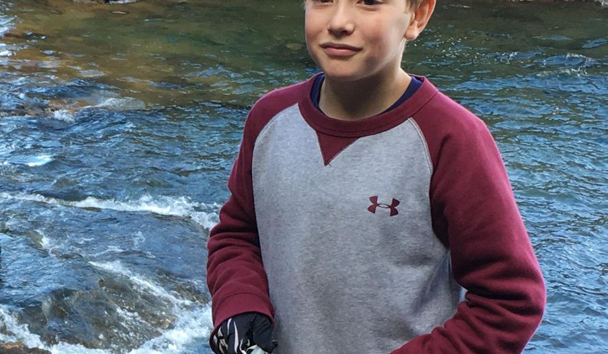 This undated family photo provided by Katrina Gross shows her son Tysen Benz. Benz, an 11-year-old Michigan boy hanged himself in his room after seeing social media posts indicating that his girlfriend had committed suicide. The posts turned out to be a prank. Now the boy's mother, Katrina Goss, says school officials should have done more to prevent his death. Goss says the girlfriend attended the same school as Tysen. He died Tuesday, April 4, 2017, at a Detroit hospital. (Katrina Gross via AP)