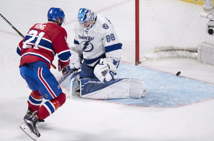 Montreal Canadiens' Dwight King (21) scores past Tampa Bay Lightning goalie Andrei Vasilevskiy during second-period NHL hockey action in Montreal, Friday, April 7, 2017. (Paul Chiasson/The Canadian Press via AP)