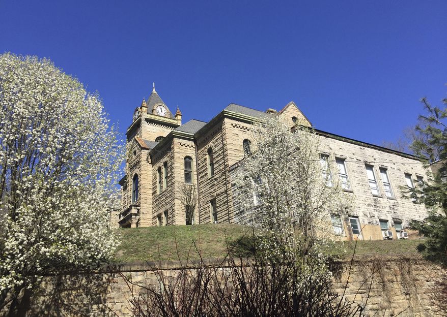 In this March 12, 2017 photo, The McDowell County Courthouse is seen, in Welch, W.Va. Mayor Reba Honacker filed a lawsuit in February 2017, at the McDowell County Courthouse, two blocks from her office in Welch, West Virginia, against five of the largest U.S. painkiller distributors. She wants them to answer for profiting from the region's opioid epidemic fueled by excessively large pill shipments over a decade and then use any proceeds to establish a local drug-rehabilitation center. (AP Photo/S.M. Christman)