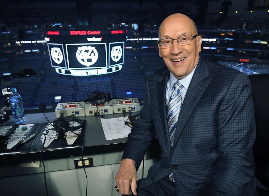 Los Angeles Kings broadcaster Bob Miller poses in his booth prior to an NHL hockey game against the Chicago Blackhawks as he gets ready to announce his last home game before retiring, Saturday, April 8, 2017, in Los Angeles. (AP Photo/Mark J. Terrill)
