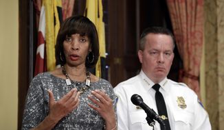 In this Tuesday, April 4, 2017, file photo, Baltimore Mayor Catherine Pugh, left, speaks alongside Baltimore Police Department Commissioner Kevin Davis at a news conference at City Hall in Baltimore. On Jan. 11, 2018, Ms. Pugh announced that six buildings in the city&#39;s Gilmor Homes housing project would be demolished, calling them a hotbed for criminal activity. (AP Photo/Patrick Semansky, File)