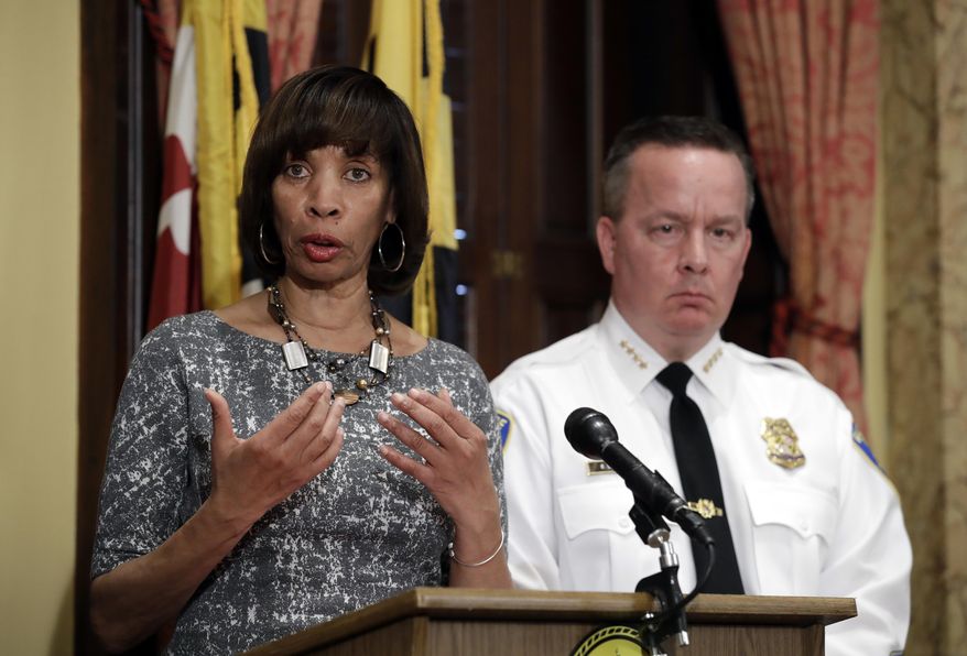 In this Tuesday, April 4, 2017, file photo, Baltimore Mayor Catherine Pugh, left, speaks alongside Baltimore Police Department Commissioner Kevin Davis at a news conference at City Hall in Baltimore. On Jan. 11, 2018, Ms. Pugh announced that six buildings in the city&#39;s Gilmor Homes housing project would be demolished, calling them a hotbed for criminal activity. (AP Photo/Patrick Semansky, File)