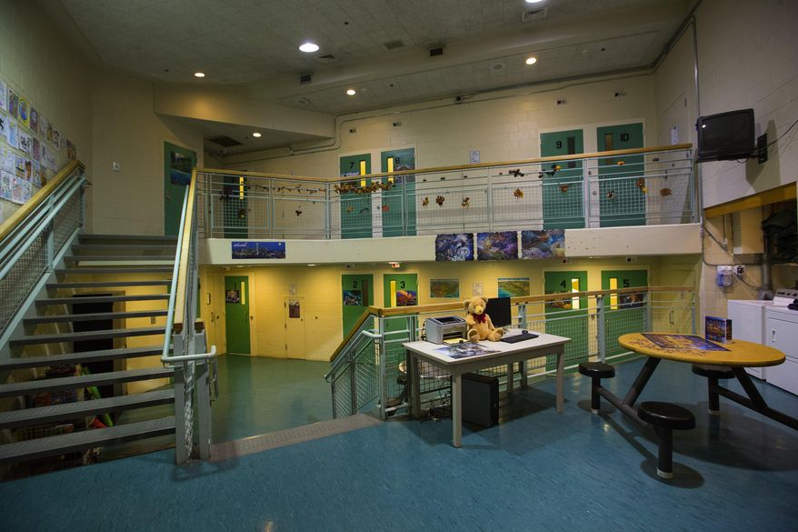 This Nov. 17, 2015 photo shows N Hall at King County Juvenile Detention Facility in Seattle, which houses both boys and girls who are detained for a variety of reasons. Recent court cases, legislation and high-profile crimes highlight the debate over the treatment of young offenders. For the past 20 years, it’s been up to county prosecutors across the state to decide which 16- and 17-year-olds accused of committing certain violent crimes are “auto declined” to adult, or superior, court and which ones are prosecuted in the juvenile system. (Ellen M. Banner /The Seattle Times via AP)