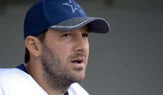 FILE - In this Aug. 1, 2016, file photo, Dallas Cowboys quarterback Tony Romo takes to reporters at the end of practice in Oxnard, Calif.  Two people with knowledge of the plan say Romo will be an honorary Dallas Mavericks player for their home finale, wearing his football No. 9 while sitting on the bench. Romo can be added to the Mavericks’ roster for a day because of an open spot, one of the people told The Associated Press on Saturday, April 8, 2017.  (AP Photo/Gus Ruelas, File)