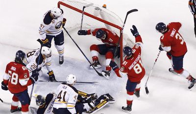 Florida Panthers center Jonathan Huberdeau (11) ends up in the net as he scores a goal against the Buffalo Sabres during the second period of an NHL hockey game, Saturday, April 8, 2017, in Sunrise, Fla. (AP Photo/Joel Auerbach)