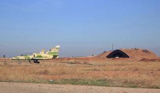 FILE - In this file photo released on Wednesday, Nov. 11, 2015 by the Syrian official news agency SANA, shows warplanes inside the Kweiras air base, east of Aleppo, Syria. A U.S. missile attack on Friday, April 7, 2017 has caused heavy damage to one of Syria&#39;s biggest and most strategic air bases, used to launch warplanes to strike opposition-held areas in central, northern and southern Syria. (SANA via AP, File)