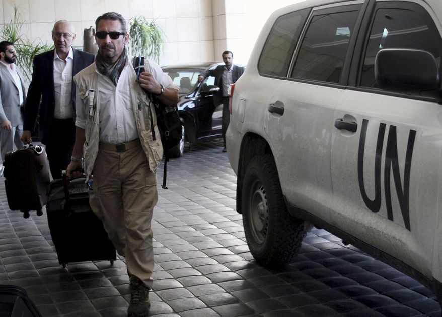 FILE -- In this Wednesday, Sept. 25, 2013 file photo, U.N. experts arrive to the Four Seasons hotel in Damascus, Syria. Assad is supposed to have declared and destroy his chemical weapon stockpile under U.N. supervision in 2014. Yet no one questioned the fact that he did, or seemed particularly surprised. (AP Photo, File)