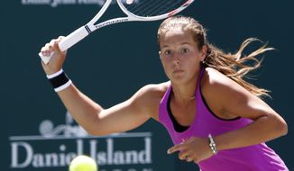 Daria Kasatkina, from Russia, returns a shot to Jelena Ostapenko, from Latvia, during their finals match at the Volvo Car Open in Charleston, S.C., Sunday, April 9, 2017. Kasatkina won 6-3, 6-1.(AP Photo/Mic Smith)