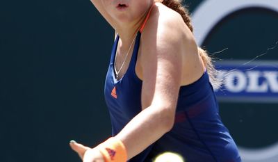 Jelena Ostapenko, from Latvia, returns a shot to Daria Kasatkina, from Russia, during their finals match at the Volvo Car Open in Charleston, S.C., Sunday, April 9, 2017. Kasatkina won 6-3, 6-1.(AP Photo/Mic Smith)
