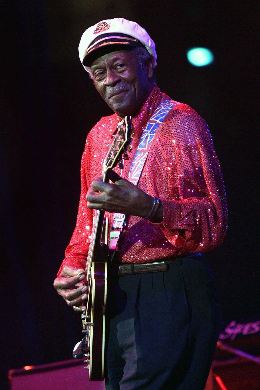 FILE - In this Saturday, May 30, 2009 file photo, Chuck Berry performs at The Domino Effect, a tribute concert to New Orleans rock and roll musician Fats Domino, at the New Orleans Arena in New Orleans. Fans can file past Berry's casket later Sunday, April 9, 2017, at a St. Louis club where he often performed. After the public viewing, a private service will be held for family and friends of the music legend, who died March 18 at age 90. (AP Photo/Patrick Semansky)