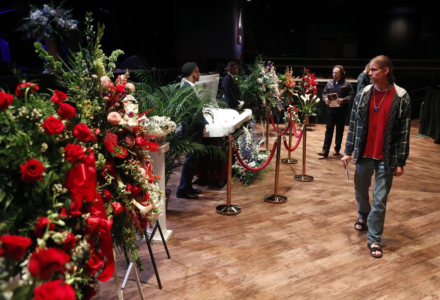 Fans pay their respects to the rock 'n' roll legend Chuck Berry during a public viewing Sunday, April 9, 2017, in St. Louis. The man behind such classics as "Johnny B. Goode," ''Sweet Little Sixteen" and "Roll Over Beethoven" died on March 18 at the age of 90. (AP Photo/Jeff Roberson)