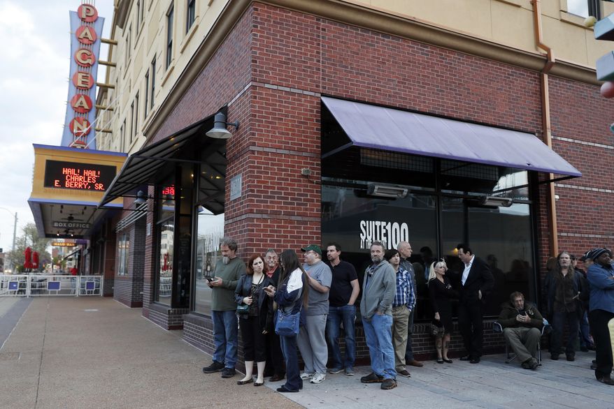 Fans stand in line for a chance to pay their respects to the rock 'n' roll legend Chuck Berry during a public viewing ahead of his celebration of life and private burial Sunday, April 9, 2017, in St. Louis. The man behind such classics as "Johnny B. Goode," ''Sweet Little Sixteen" and "Roll Over Beethoven" died on March 18 at the age of 90. (AP Photo/Jeff Roberson)