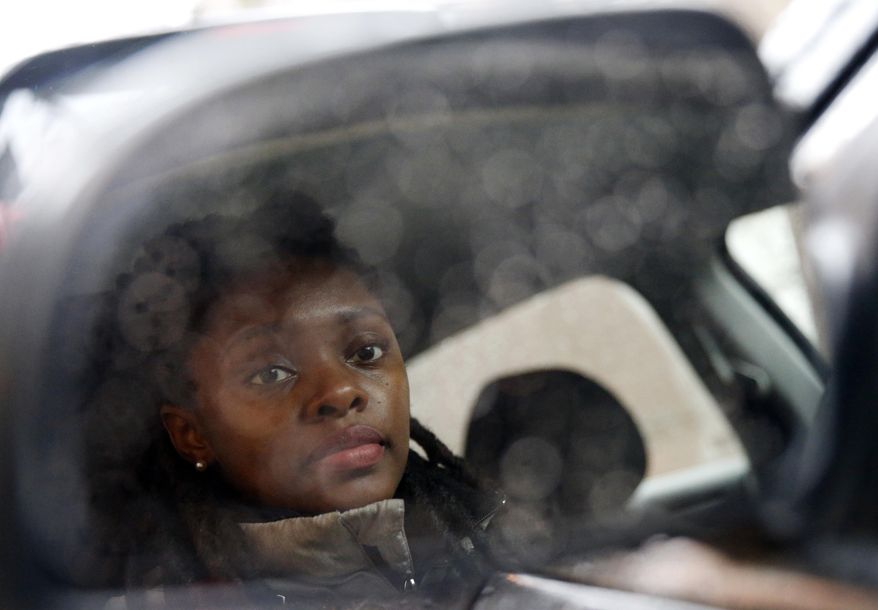 In this Wednesday, April 5, 2017 photo, Kara Bland sits in her car in Chicago. Bland’s 2010 Chevy Malibu still had temporary plates when police seized it for a crime she did not commit. She loaned it to the father of her daughter, who was arrested after picking up someone who had marijuana on him. For six weeks, Bland took her daughter to school on a Chicago city bus and relatives helped her run errands before a judge released the car on bond. It took a total of nine months to officially regain ownership and cost her $1,000. (AP Photo/Nam Y. Huh)