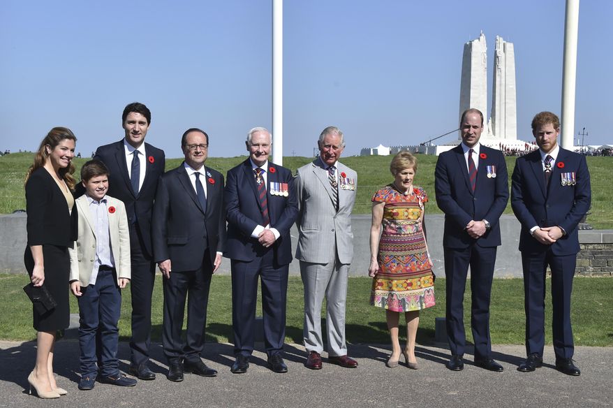 Canadian Prime Minister Justin Trudeau, 3rd left, his wife Sophie Gregoire, left, and son Xavier, 2nd left, French President Francois Hollande, 4th left, Governor General of Canada David Johnston, 5th left, and his wife Sharon, 3rd right, Britain's Charles, Prince of Wales (4th right, Britain's Prince William, Duke of Cambridge, 2nd left, and Britain's Prince Harry, right, pose at the Canadian National Vimy Memorial in Vimy, near Arras, northern France, as they attend the commemorations of the 100th anniversary of the Battle of Vimy Ridge, a World War I battle which was a costly victory for Canada but one that helped shape the former British colony's national identity, Sunday, April 9, 2017. (Philippe Huguen/Pool Photo via AP)