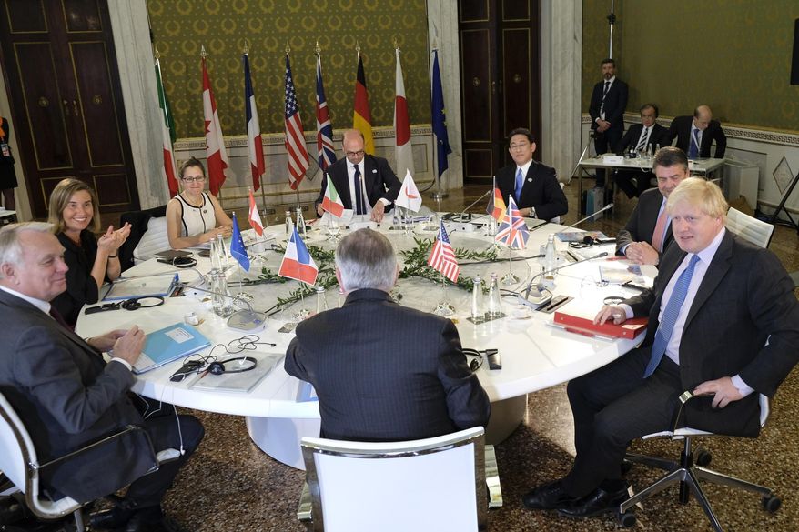 From Left: France Foreign Minister Jean-Marc Ayrault, High Representative of the European Union for Foreign Affairs and Security Policy Federica Mogherini, Canadian Foreign Minister Chrystia Freeland, Italian Foreign Minister Angelino Alfano, Japanese Foreign Minister Fumio Kishida, Secretary of State for Foreign and Commonwealth Affairs Boris Johnson and US Secretary of State Rex Tillerson, sit at the table during the meeting of Foreign Ministers of the G7 countries in Lucca, Italy, Monday, April 10, 2017. Foreign ministers from the Group of Seven industrialized nations are gathering in Lucca for a meeting given urgency by the chemical attack in Syria and the U.S. military response, with participants aiming to pressure Russia to end its support for President Bashar Assad. (Riccardo Dalle Luche/ANSA via AP)