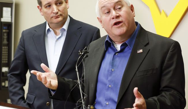 Kansas 4th District congressional candidate Ron Estes, right, and Sen. Ted Cruz who came to Wichita to campaign for Estes the day before a special election speak to the media during a news conference before their rally at Yingling Aviation, Monday, April 10, 2017, in Wichita, Kan. (Fernando Salazar/The Wichita Eagle via AP)