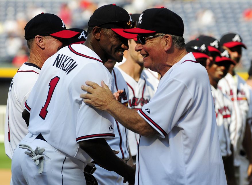 FILE - In this Aug. 13, 2011 file photo, former Atlanta Braves player Otis Nixon, left, is greeted by former Braves manager Bobby Cox during a Braves Legends Game featuring the 1991 Braves against all other Braves alumni in Atlanta, before a baseball game against the Chicago Cubs. Police in Georgia are looking for Nixon, who disappeared over the weekend. In a Facebook post, the Woodstock Police Department says Nixon, who's 58, was last seen leaving his home in the morning on Saturday, April 8, 2017 in a gray Range Rover. Police say he was on his way to a local golf course but never arrived. (AP Photo/Dave Tulis, File)