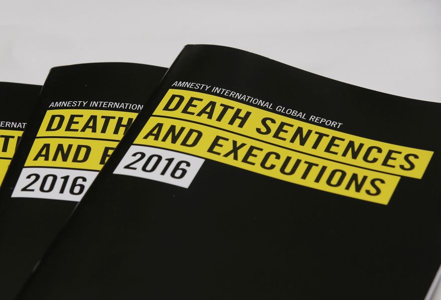 In this Monday, April 10, 2017 photo, the copies of reports on the death penalty are displayed during a press conference of Amnesty International in Hong Kong. Human rights activists say China&#x27;s use of the death penalty remains shrouded in secrecy and still outpaces the rest of the world combined, even after the nation&#x27;s execution rate fell sharply in recent years. (AP Photo/Kin Cheung)