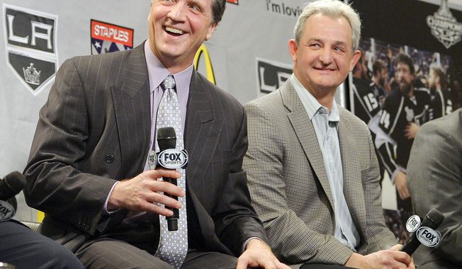 This Jan. 10, 2013 file photo shows Los Angeles Kings president and general manager Dean Lombardi and head coach Darryl Sutter laughing during a news conference to help kick off the NHL hockey team&#x27;s season in Los Angeles. The Kings have fired Sutter and Lombardi, who led the franchise to its only two Stanley Cup championships. On Monday, April 10, 2017, the team also promoted former defenseman Rob Blake to vice president and general manager, while longtime executive Luc Robitaille will be their new team president in charge of all hockey and business operations. (AP Photo/Mark J. Terrill, file)