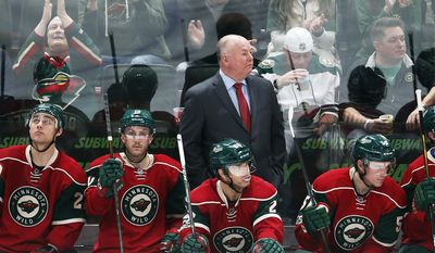 FILE - In this Feb. 18, 2017 file photo Minnesota Wild head coach Bruce Boudreau watches his NHL hockey team play against the Nashville Predators in St. Paul, Minn. Boudreau is back in the playoffs with a third team, the Minnesota Wild in his debut season. For the eighth time in this unique character of a coach&#39;s nine postseason appearances, his team has one of the top two records in its conference. (AP Photo/Jim Mone,File)