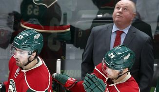 FILE - In this Feb. 18, 2017, file photo, Minnesota Wild head coach Bruce Boudreau watches the replay of a goal by Minnesota Wild&#39;s Mikko Koivu, of Finland, during the third period of an NHL hockey game in St. Paul, Minn. Boudreau is back in the playoffs with a third team, the Minnesota Wild in his debut season. For the eighth time in this unique character of a coach&#39;s nine postseason appearances, his team has one of the top two records in its conference. But that 1-7 career Game 7 record can&#39;t be ignored. (AP Photo/Jim Mone, File)