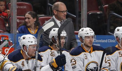 Buffalo Sabres head coach Dan Bylsma, center top, looks on during the second period of an NHL hockey game against the Florida Panthers, Saturday, April 8, 2017, in Sunrise, Fla. (AP Photo/Joel Auerbach)