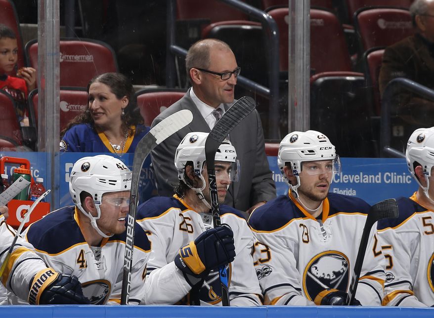 Buffalo Sabres head coach Dan Bylsma, center top, looks on during the second period of an NHL hockey game against the Florida Panthers, Saturday, April 8, 2017, in Sunrise, Fla. (AP Photo/Joel Auerbach)
