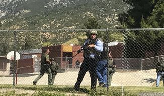 Emergency personnel respond to a shooting inside North Park School Elementary School on Monday, April 10, 2017, in San Bernardino, Calif. (Rick Sforza/Los Angeles Daily News via AP)