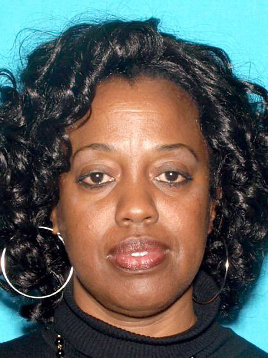 This undated photo released by the San Bernardino Police Department shows Karen Elaine Smith, 53. Smith has been identified by authorities as one of the people shot by Cedric Anderson, identified as her estranged husband, as she taught a special education class at North Park Elementary School in San Bernardino, Calif., Monday, April 10, 2017. (San Bernardino Police Department via AP)