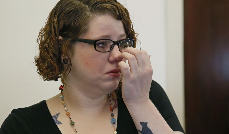 In this Monday, April 10, 2017 photo, Derina Soles fights back tears during an interview in Oklahoma City. After years of trying unsuccessfully to have a baby, Soles said she was excited to attend her first ultrasound and find out the gender of her new baby. Soles learned her fetus had anencephaly, a rare and untreatable defect in which a baby's brain and skull don't form properly, and made the decision to terminate the pregnancy. (AP Photo/Sue Ogrocki)