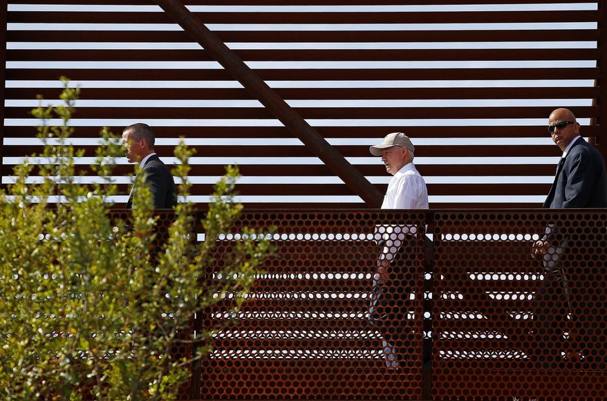 Attorney General Jeff Sessions, center, tours the U.S.-Mexico border with border officials, Tuesday, April 11, 2017, in Nogales, Ariz. Sessions toured the U.S.-Mexico border and unveiled what he described as a new get-tough approach to immigration prosecutions under President Donald Trump. (AP Photo/Ross D. Franklin)
