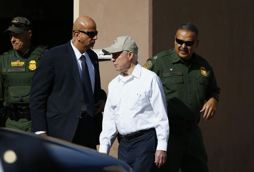 Attorney General Jeff Sessions, center, arrives for a tour of the U.S.-Mexico border with border officials, Tuesday, April 11, 2017, in Nogales, Ariz. Sessions toured the U.S.-Mexico border and unveiled what he described as a new get-tough approach to immigration prosecutions under President Donald Trump. (AP Photo/Ross D. Franklin)