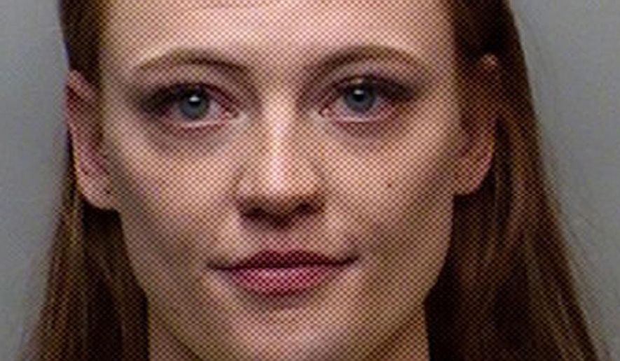 Recropped-This is a Friday, April 7, 2017, booking photograph of 22-year-old Michaella Surat supplied by the Fort Collins, Colo., Police Department. Surat, a junior at Colorado State University, has been charged on suspicion of third-degree assault and obstructing a peace officer. A video spreading on social media shows a Fort Collins Police Department officer throwing Surat face-first onto a sidewalk after a scuffle. (Fort Collins, Colo., Police Department via AP)