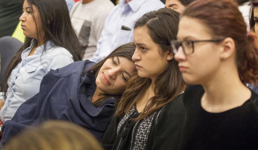 Students listen to the debate Tuesday, April 11, 2017, over a bill seeking to offer in-state tuition rates to public college students whose parents brought them to the country illegally in Nashville, Tenn. The measure was narrowly defeated in the House Education Administration and Planning Committee. (AP Photo/Erik Schelzig)