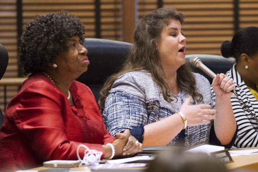 Rep. Dawn White, R-Murfreesboro, speaks against a bill seeking to offer in-state tuition rates to public college students whose parents brought them to the country illegally in Nashville, Tenn., on Tuesday, April 11, 2017. The measure was narrowly defeated in the House Education Administration and Planning Committee. At left is Rep. Johnnie Turner, D-Memphis, who voted for the measure. (AP Photo/Erik Schelzig)