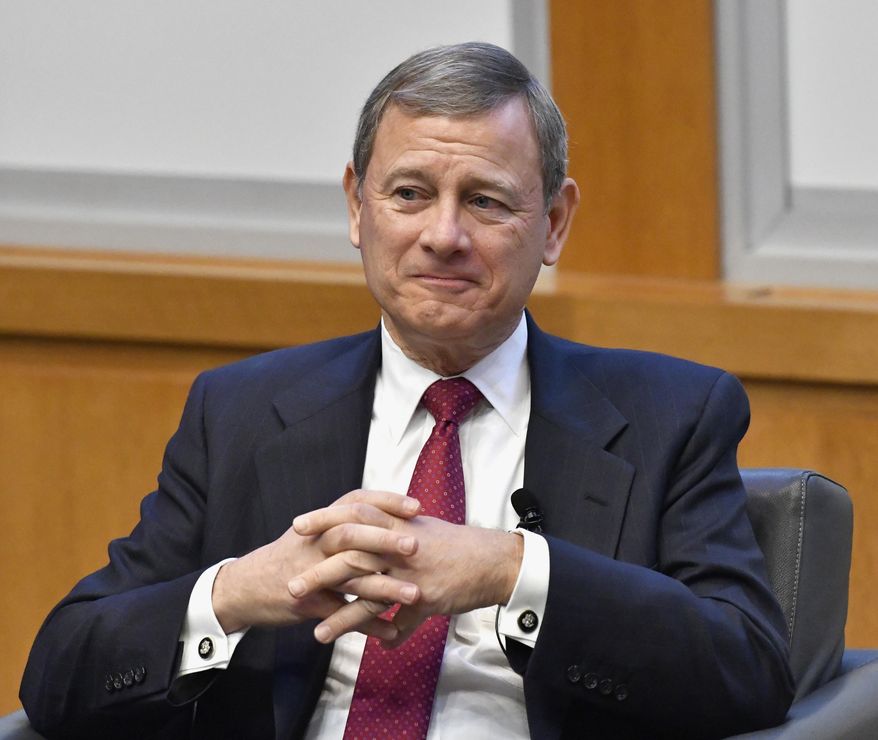 In this Feb. 1, 2017, file photo, U.S. Supreme Court Chief Justice John Roberts prepares to speak at the The John G. Heyburn II Initiative and University of Kentucky College of Law&#x27;s judicial conference and speaker series in Lexington, Ky. (AP Photo/Timothy D. Easley, File)