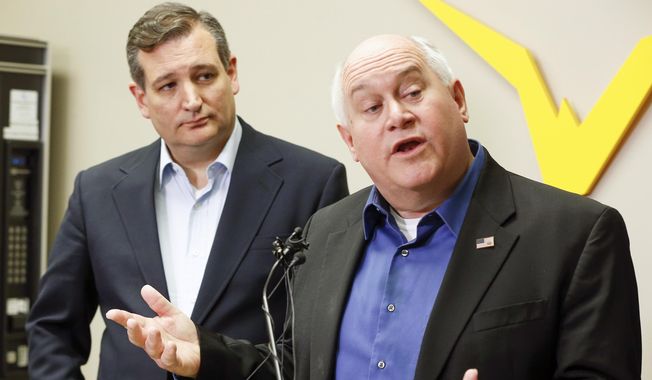 Kansas 4th District congressional candidate Ron Estes, right, and Sen. Ted Cruz who came to Wichita to campaign for Estes the day before a special election speak to the media during a news conference before their rally at Yingling Aviation, Monday, April 10, 2017, in Wichita, Kan. (Fernando Salazar/The Wichita Eagle via AP)