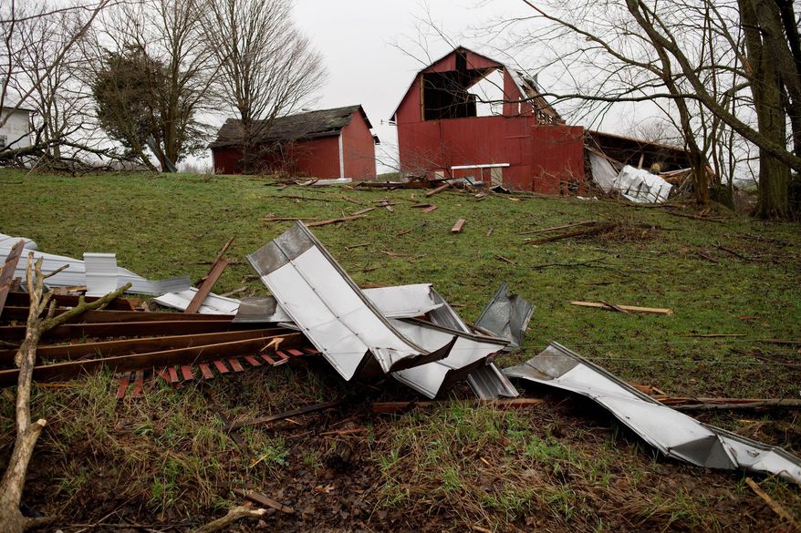 A barn sits partially destroyed by a severe storm off of 92nd Street between Wingeier Avenue and Hastings Road in Alto on Tuesday, April 11, 2017. Authorities say severe thunderstorms Monday night spawned a suspected tornado in western Michigan, knocking down a barn and blocking roadways with debris. (Neil Blake/The Grand Rapids Press via AP)