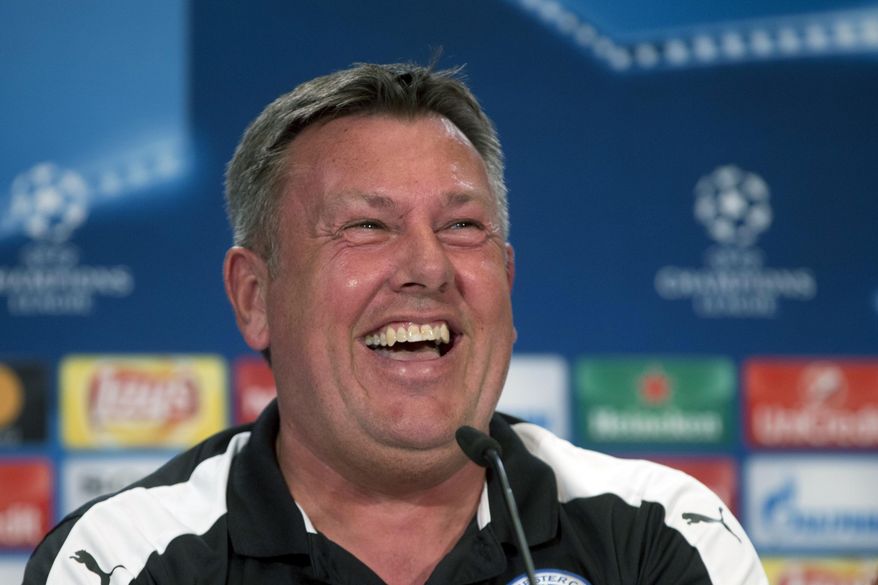 Leicester coach Craig Shakespeare laughs during a press conference at the Vicente Calderon stadium in Madrid, Spain Tuesday April 11, 2017. Leicester will play Atletico Madrid Wednesday in a Champions League quarterfinal, first leg soccer match in Madrid.(AP Photo/Paul White)