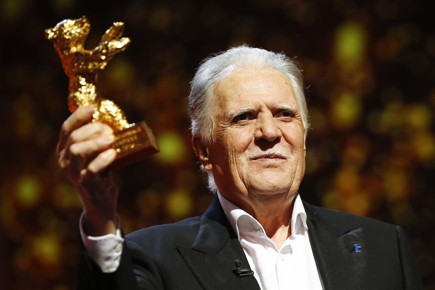 FILE - In this Feb. 18, 2016 file photo German cinematographer Michael Ballhaus shows the Honorary Golden Bear after being awarded for his lifetime achievement during the awarding ceremony at the 2016 Berlinale Film Festival in Berlin, Germany. Ballhaus has died. He was 81. (AP Photo/Axel Schmidt, file)