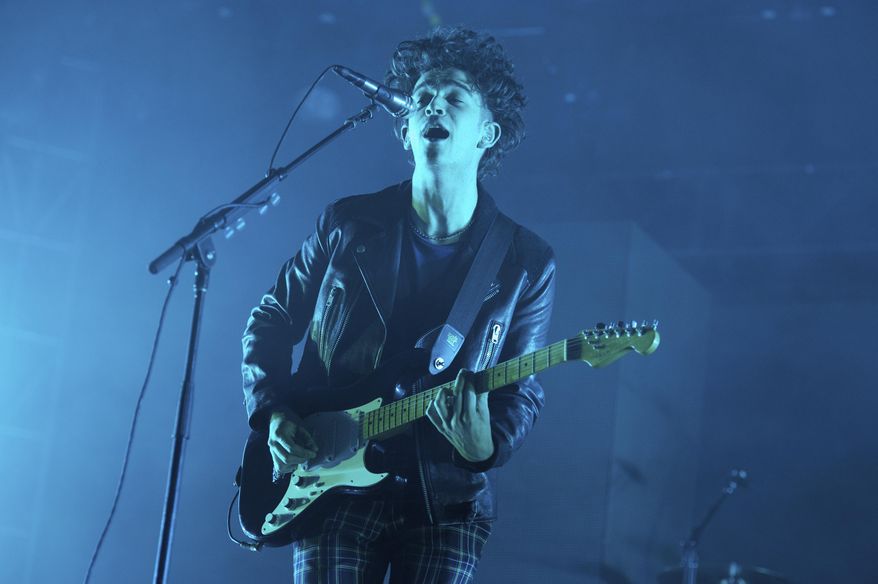 FILE - In this Oct. 2, 2016 file photo, Matthew Healy of The 1975 performs at the 2016 The Meadows Music and Arts Festivals at Citi Field in New York. The 1975 is currently on its latest U.S. arena tour, which launched this week. They have been lauded for their distinctive sound, which is a blend of rock, pop, R&B, electronic and other genres. (Photo by Scott Roth/Invision/AP, File)
