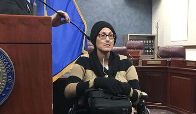 Stephanie Packer, a chronically ill patient, tells reporters she opposes physician-assisted suicide on Wednesday, April 12, 2017, at the Nevada Legislature in Carson City, Nev. She joined doctors and other activists against Senate Bill 261 at a news conference after Democratic lawmakers cancelled a hearing on the proposal that would allow Nevada physicians to prescribe life-ending drugs to patients with prognoses of six months or less to live. (AP Photo/Alison Noon) ** FILE **