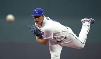 Kansas City Royals starting pitcher Jason Vargasp throws during the first inning of a baseball game against the Oakland Athletics Thursday, April 13, 2017, in Kansas City, Mo. (AP Photo/Charlie Riedel)