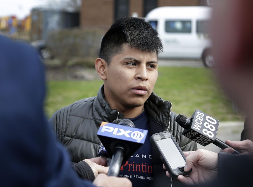 William Tigre talks to reporters at a crime scene where the bodies of four men were found in Central Islip, N.Y., Thursday, April 13, 2017. Tigre said an acquaintance told him Wednesday night that his 18-year-old brother, Jorge, was one of the victims. Police say they're investigating the disappearance of Jorge Tigre, but would not comment on whether the teenager was among those killed. (AP Photo/Seth Wenig)