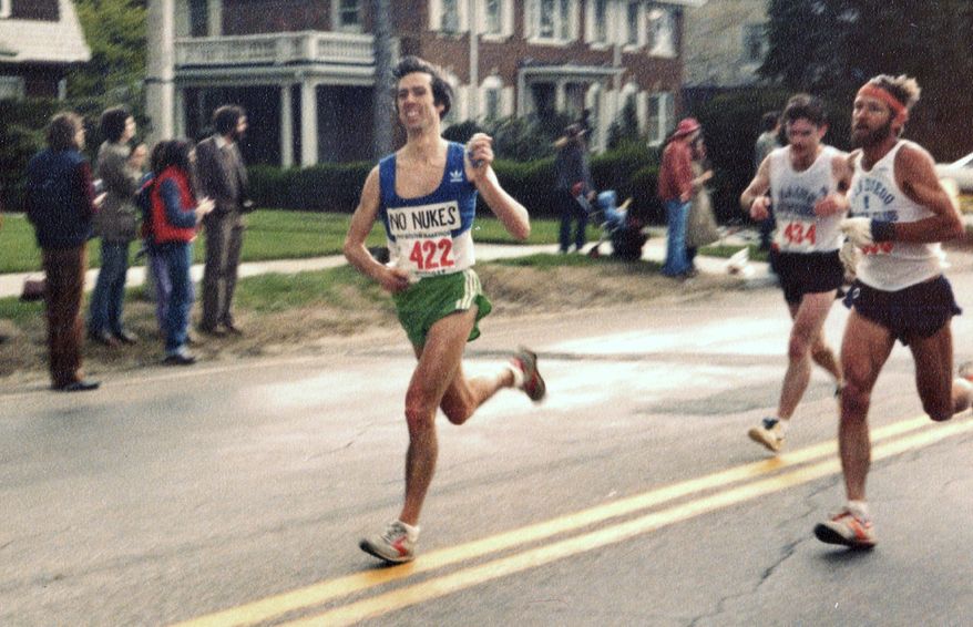 In this April 20, 1981, photo provided by Carol M. Beach, her husband Ben Beach, age 31, runs along the Boston Marathon course in Newton, Mass. Beach, of Bethesda, Md., is looking to be the first person to run the race 50 years in a row on Monday, April 17, 2017. (Carol M. Beach via AP)