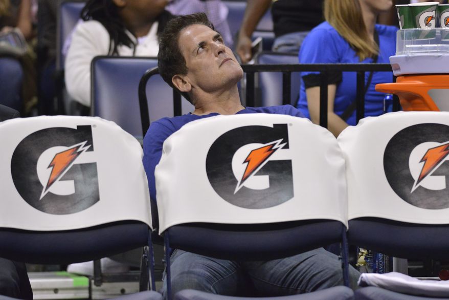 Dallas Mavericks owner Mark Cuban looks at the scoreboard in the second half of an NBA basketball game against the Memphis Grizzlies, Wednesday, April 12, 2017, in Memphis, Tenn. (AP Photo/Brandon Dill)