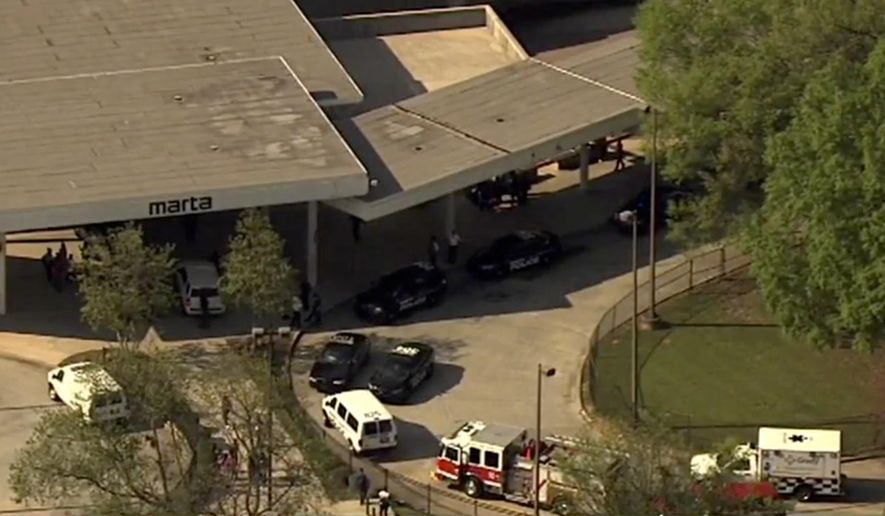 In this image made from a video provided by WSB-TV authorities respond after reports of a shooting at the West Lake station Thursday, April 13, 2017, in Atlanta. Authorities say several people were shot at the Atlanta public transit station. (WSB-TV via AP)