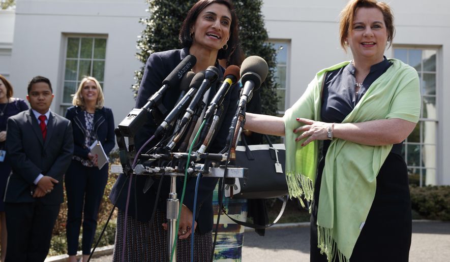 Marjorie Dannenfelser, president of the Susan B. Anthony List, right, listens as Seema Verma, administrator of the Centers for Medicare and Medicaid Services, speaks with reporters outside the White House in Washington, Thursday, April 13, 2017, after President Donald Trump signed signed H.J. Res. 43, which allows states to withhold federal funds from facilities that provide abortion services. (AP Photo/Evan Vucci)